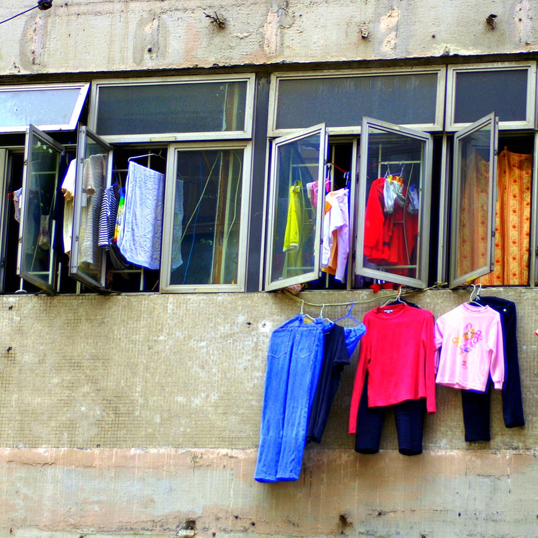 Clothing hanging from the windows of a Hong Kong home