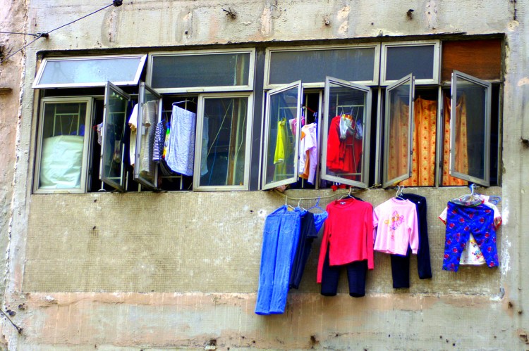 Clothing hanging from the windows of a Hong Kong home